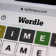 The top half of a Wordle puzzle, shown on a mobile device.